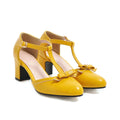 Yellow women's sandals with a chunky block heel, hollow-out design, and a buckle strap.