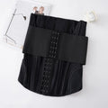 Nylon belly band waist trainer in black and apricot colours, shown laid flat.