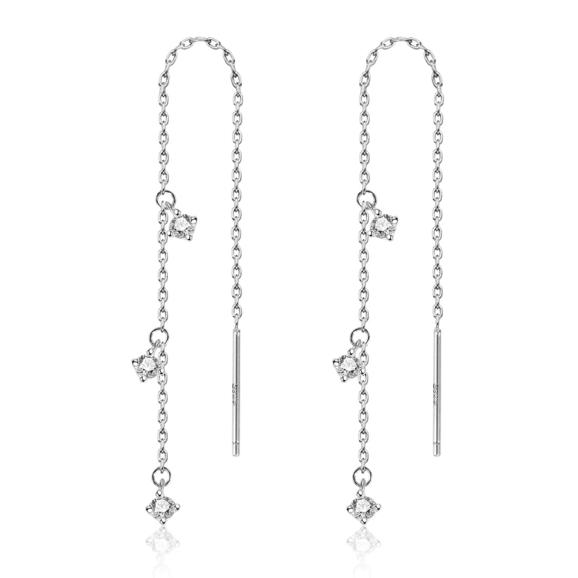 Gold pair of copper geometric round earrings with small zircon stone and ear hook closure on neutral background