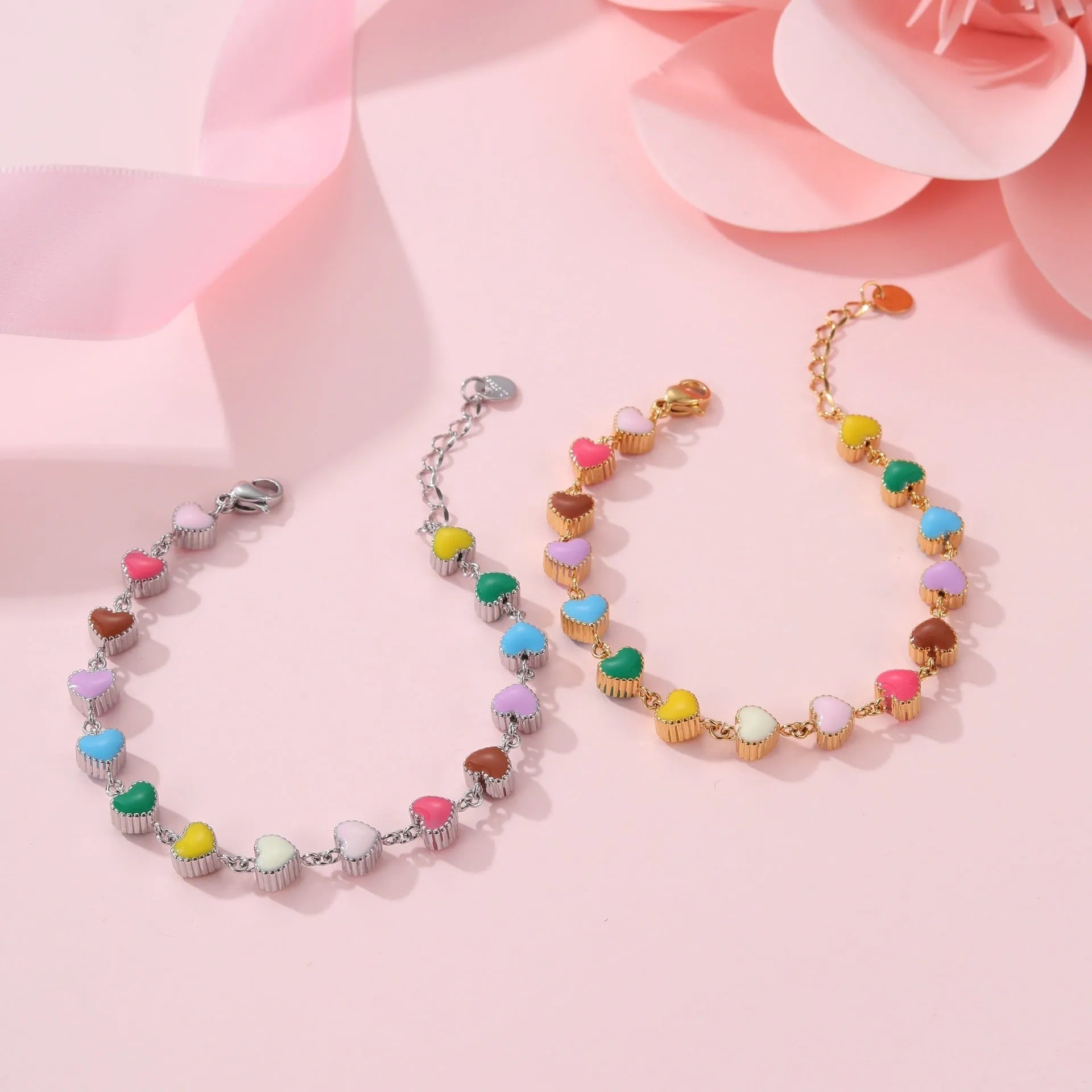 Women's gold bracelet with love heart design, stainless steel construction, and electroplated finish