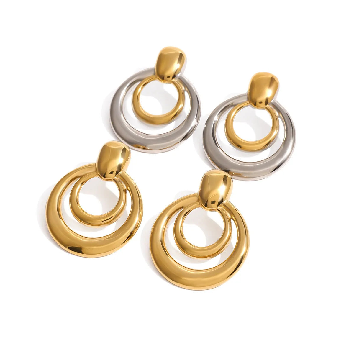 A pair of round, golden, hollow double layer stud earrings made from titanium steel with 18K gold electroplating.