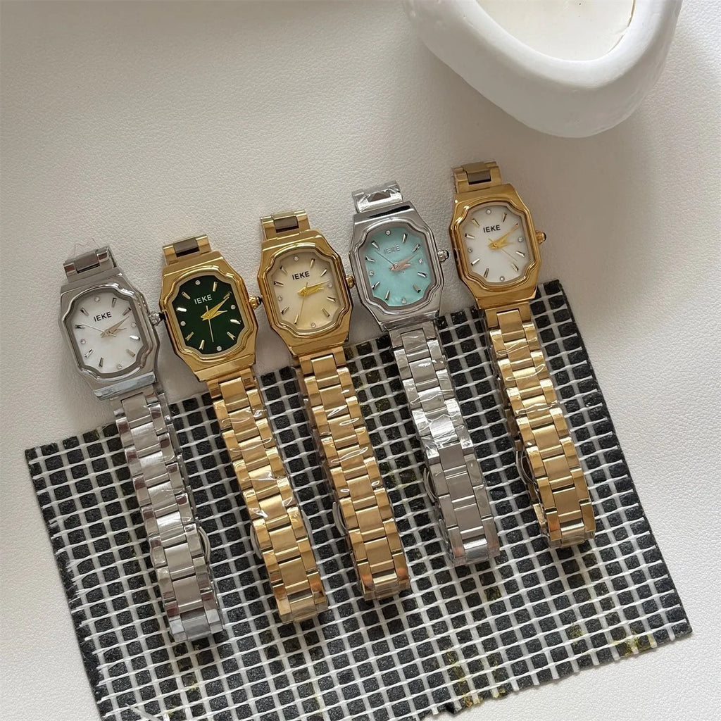 Women's small square watch with gold strap and green dial, 10mm thin, on wrist