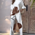White printed top and straight-leg pants casual fashion set on model
