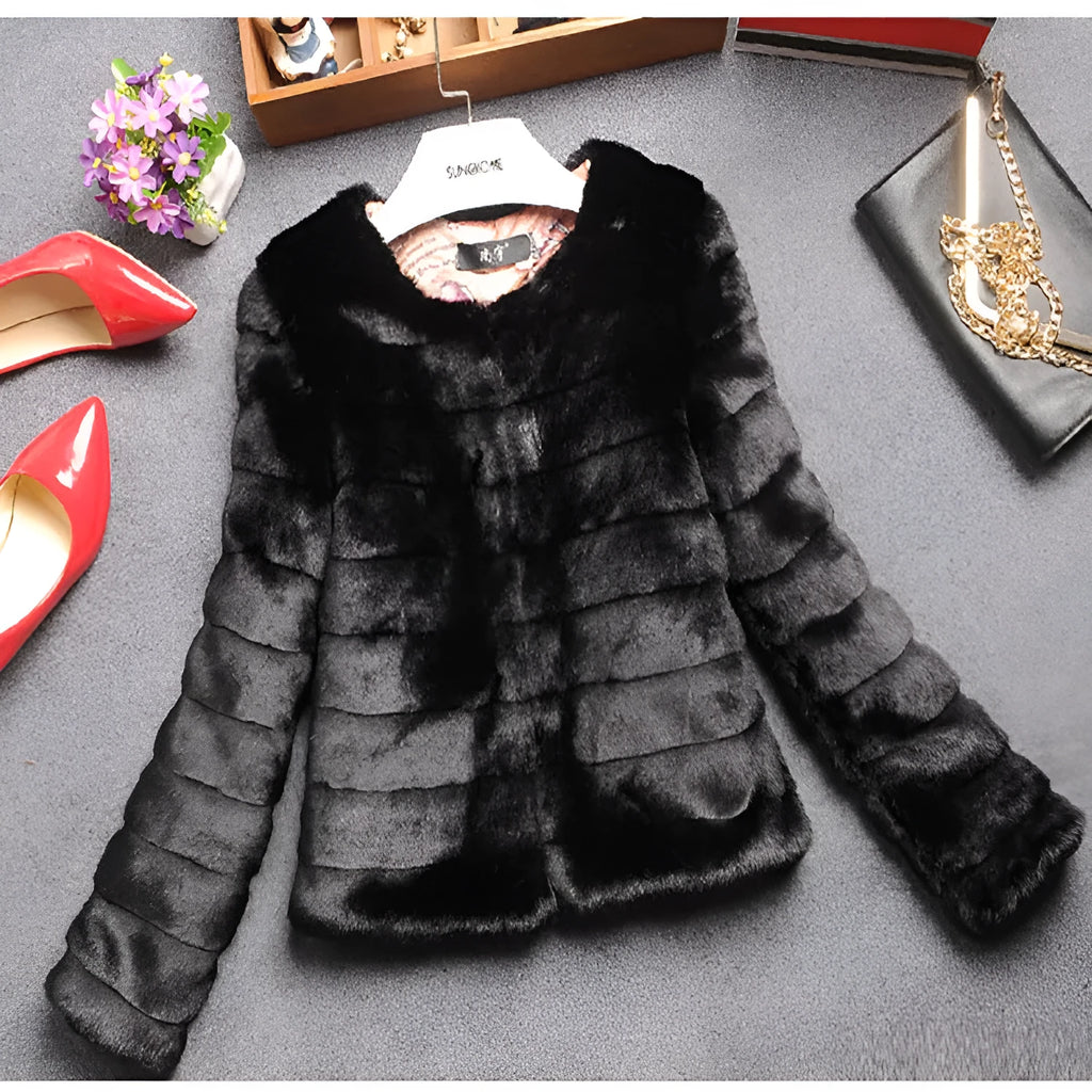 Women's short white faux fur top with regular sleeves on a model.