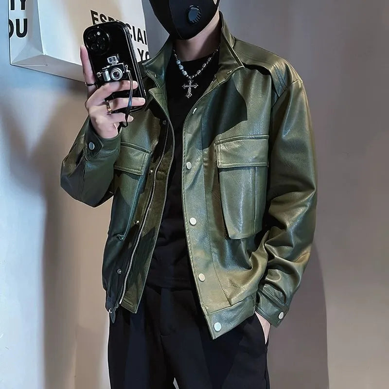 Man wearing a black Korean-style PU leather pilot jacket with a straight hem and side seam pockets.