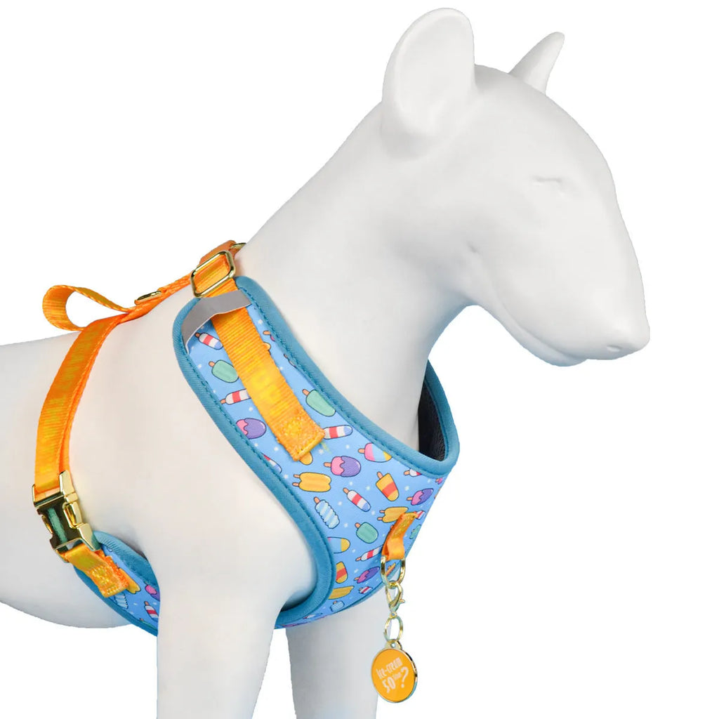 Adjustable polyester dog breast strap harness in Pink Avocado colour on a wooden surface