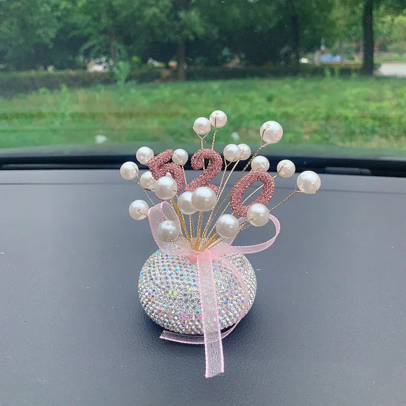 Clay diamond star decoration ornament for a car centre console in a modern colour design.