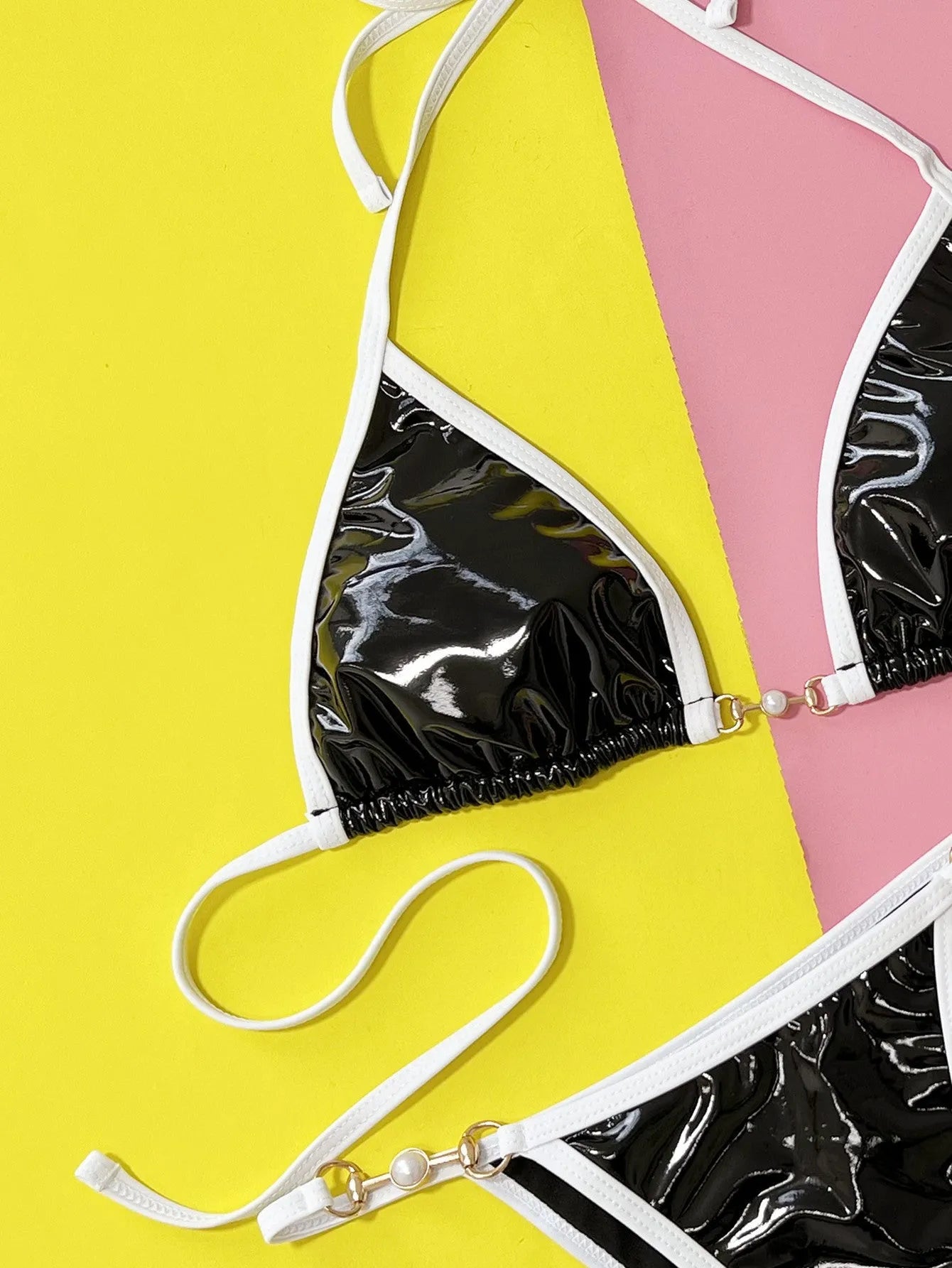 Black women's bikini swimsuit set with triangle cup top and split briefs