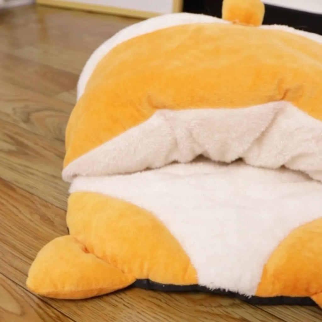 Orange semi-closed cat sleeping bag bed measuring 65 cm by 53 cm
