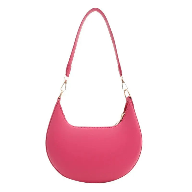 Round one-shoulder underarm bag in PU material, shown in green colour with visible sewing lines and a single strap.