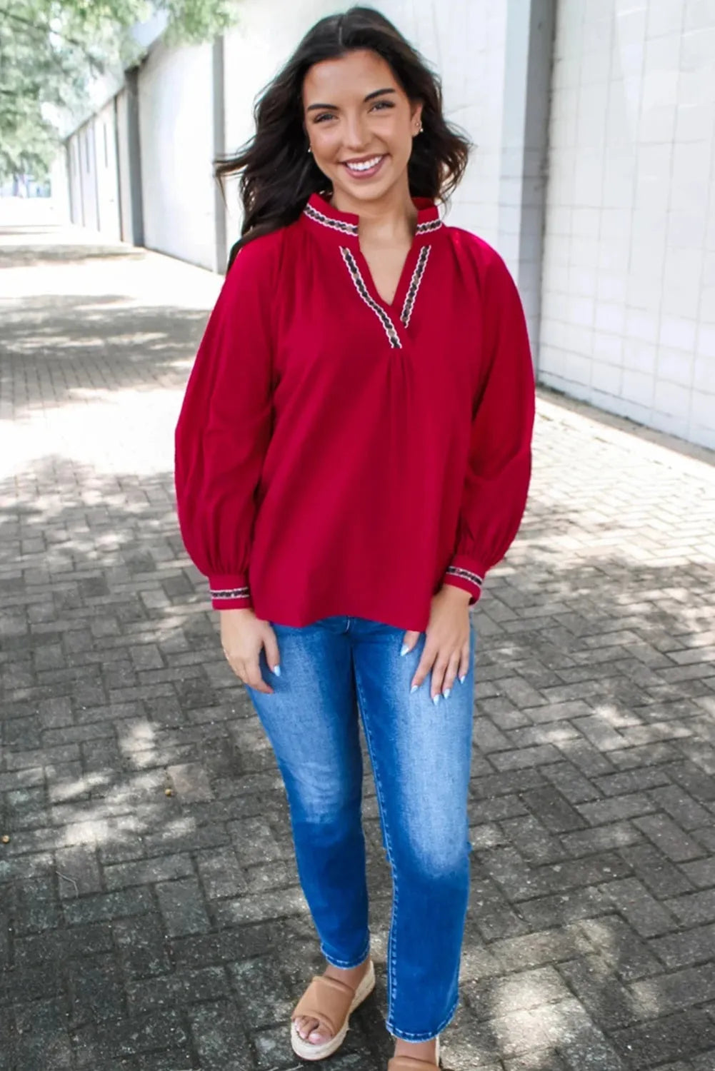 Women's red loose fit polyester pullover shirt with embroidered collar and printed detail