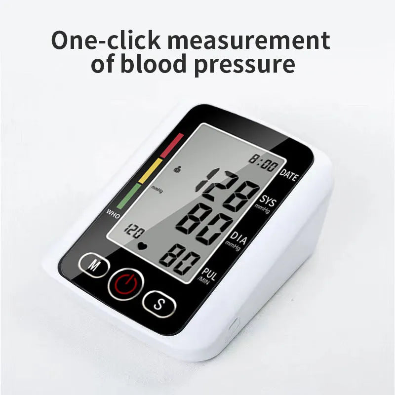 Automatic arm blood pressure monitor on a table with large screen and arm cuff.