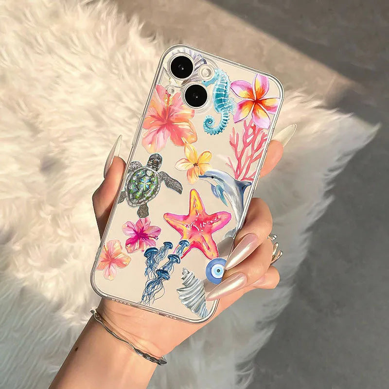 Clear TPU iPhone case with painted dolphin, turtle, plant, and shell design for anti-fall protection.