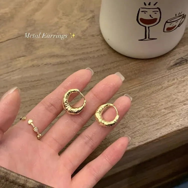 Pair of women's irregular croissant hoop earrings in copper with electroplated silver or gold finish