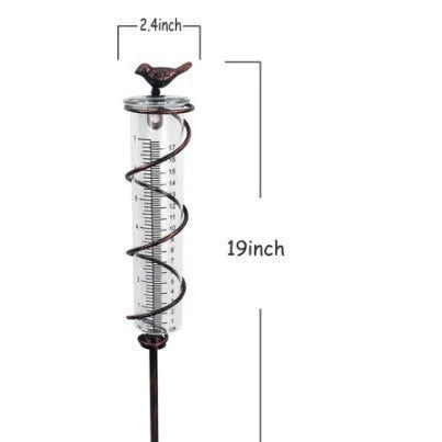 Cast iron hummingbird garden rain gauge with glass measurement tube showing 1-20 scale.