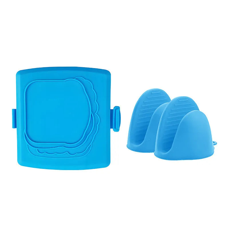 Red silicone baking tray and matching heat-resistant gloves set on kitchen counter