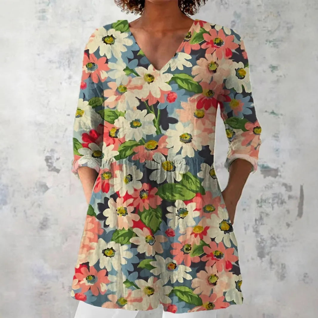 Women's retro-style slim-fit long-sleeved top with a colourful digital print pattern, shown on a model.