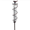 Cast iron hummingbird garden rain gauge with glass measurement tube showing 1-20 scale.