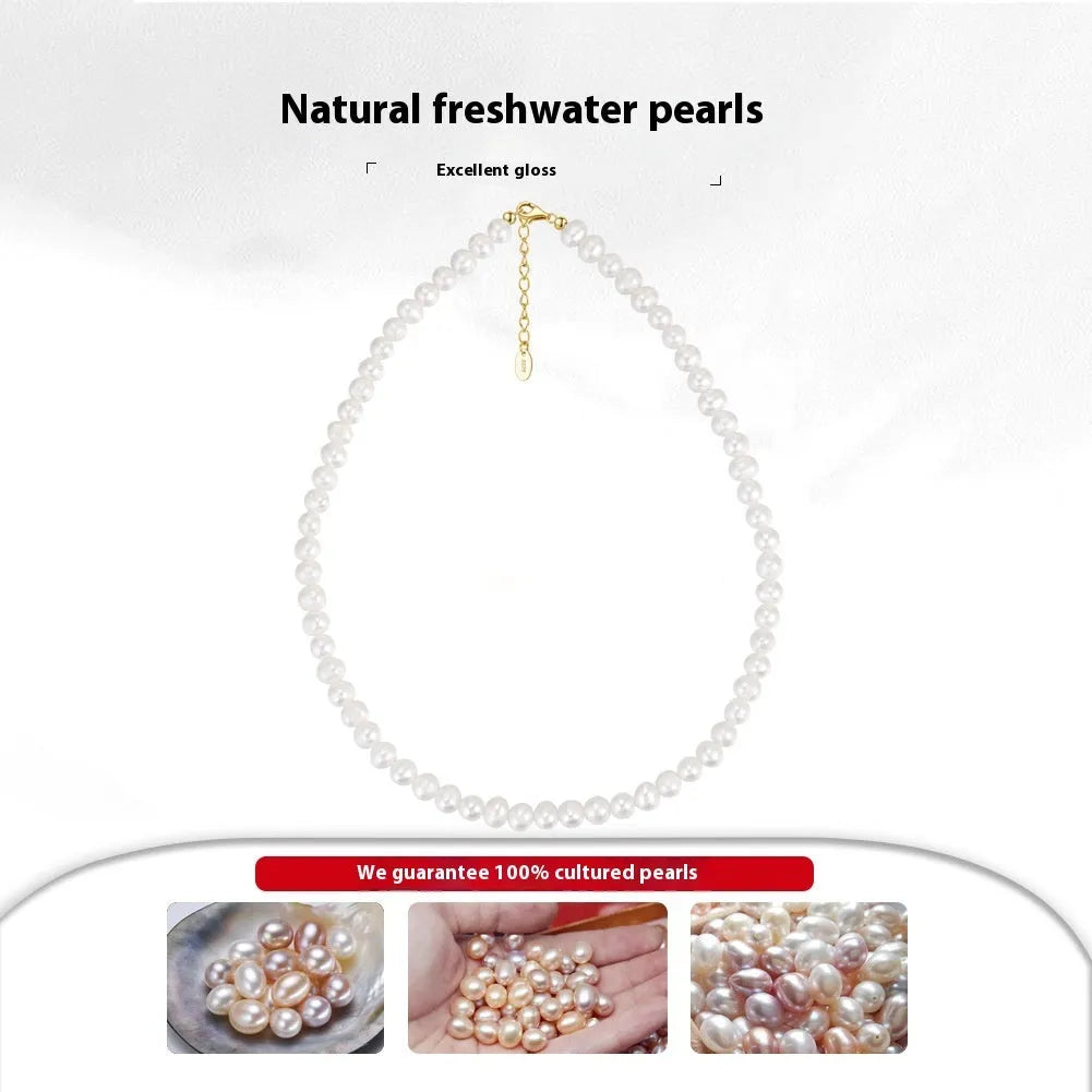 Close-up of a women's adjustable silver necklace with a natural freshwater pearl centrepiece.