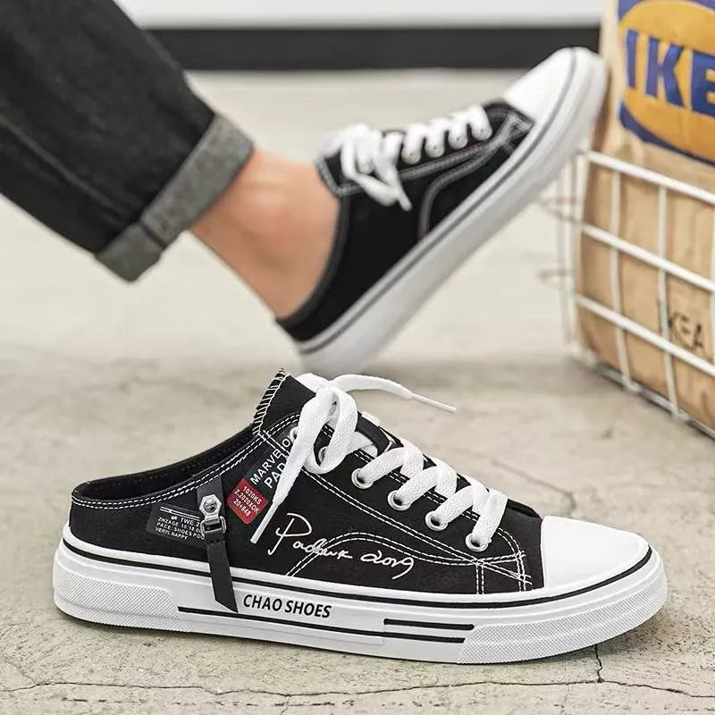 Men's black canvas slip-on shoes with round toe and PVC sole