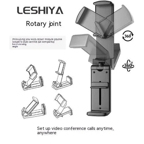 Foldable rotating universal phone holder in black on a desk next to a mobile phone.
