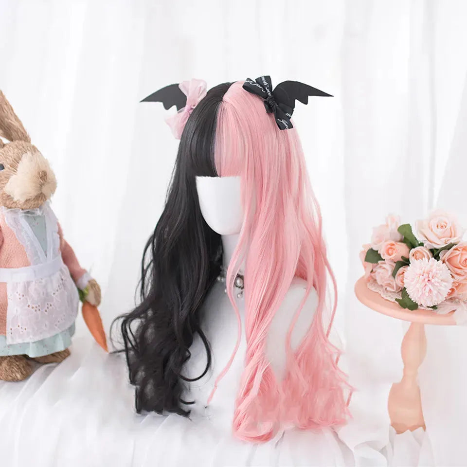 Harajuku Lolita long curly black and pink synthetic cosplay wig with bangs on a stand.