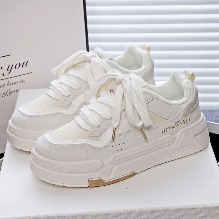 Minority board shoes in beige with thick rubber soles, cross shoulder straps, and front lace-up closure.