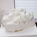 Minority board shoes in beige with thick rubber soles, cross shoulder straps, and front lace-up closure.