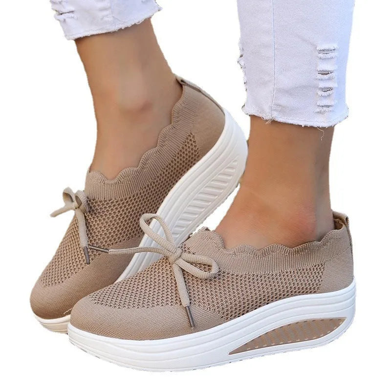 Women's fly-knit mesh sneakers in black with round toe and mid heel, fabric upper