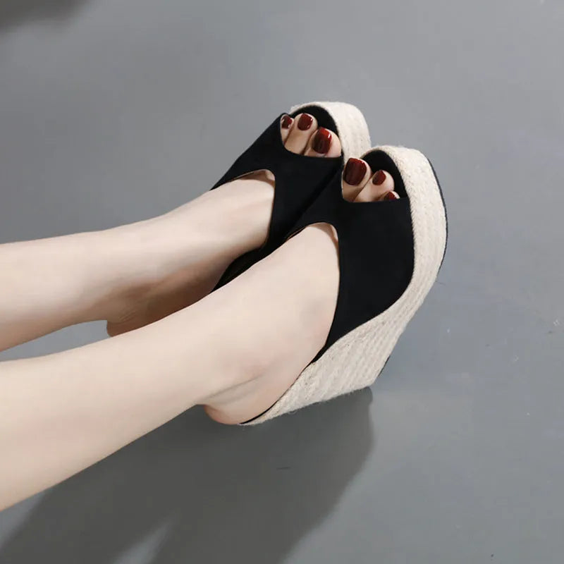 Women's black suede open toe high heel sandals with rubber sole, side view