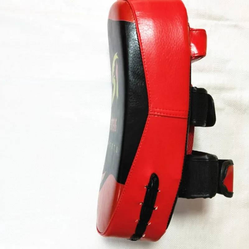 Black and red square hand-held boxing foot target pad with a rear buckle.