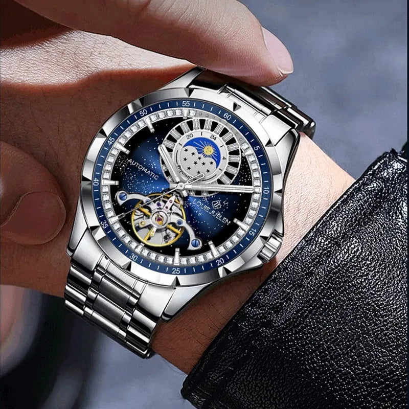Silver and blue men's automatic mechanical watch with stainless steel strap on a wrist