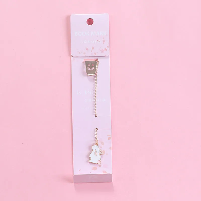 Alloy metal bookmark with cartoon pendant designs including panda, rocket and unicorn variations