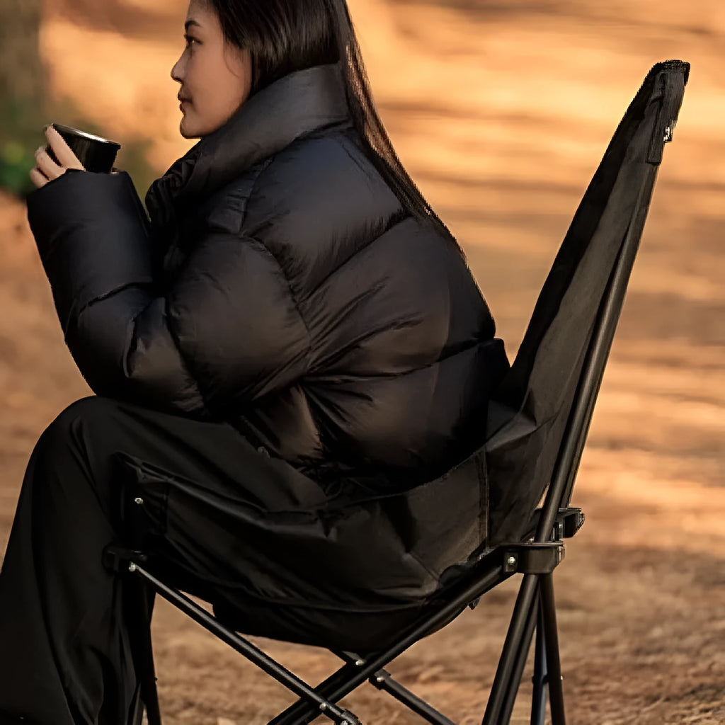 Night black portable folding moon chair in Oxford cloth for outdoor camping and beach use.