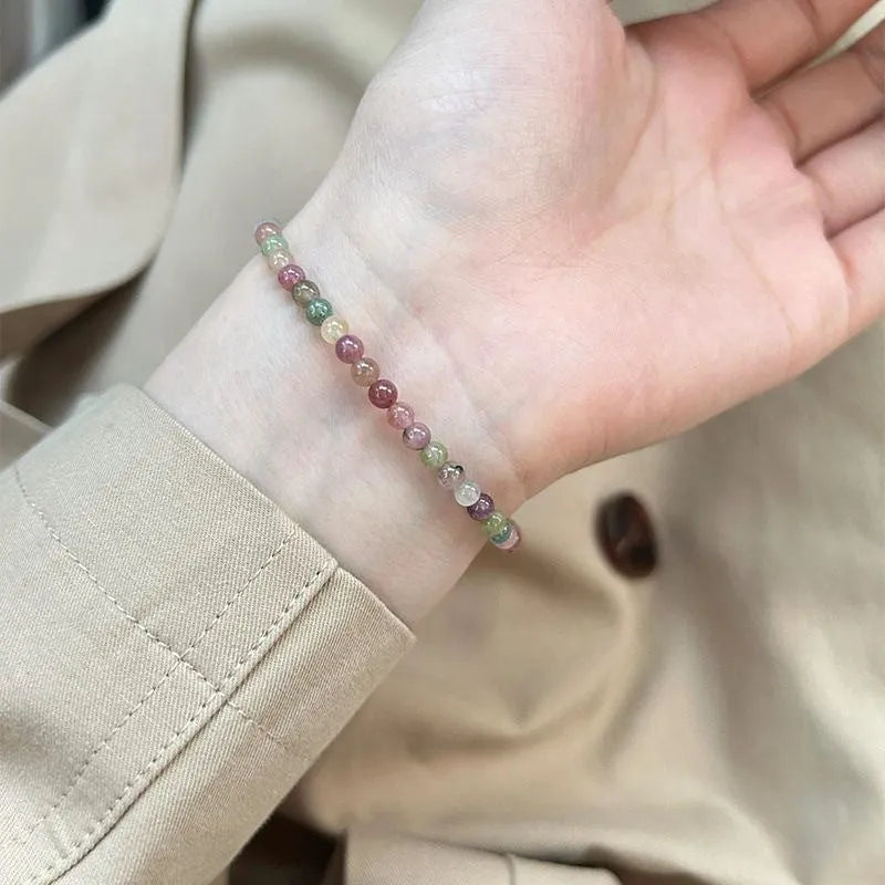 Women's pink crystal and electroplated alloy bracelet with geometric shapes in one of eight colour options.