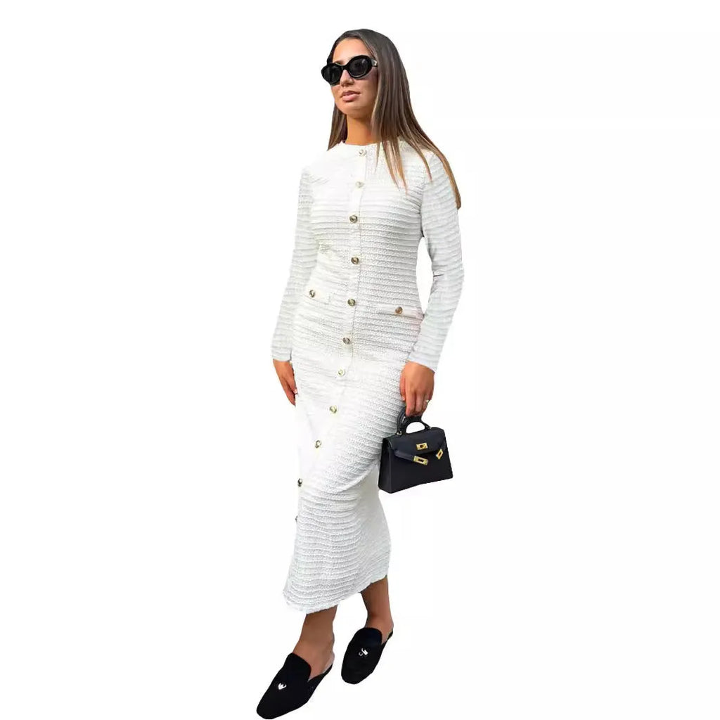 French retro slim fit knitted long-sleeved dress in black with button detail on a mannequin.
