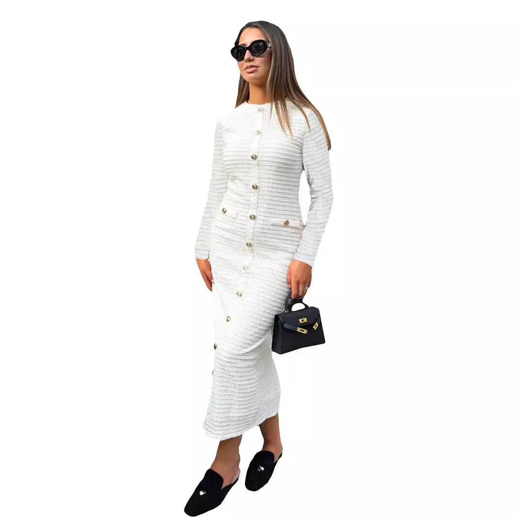 French retro slim fit knitted long-sleeved dress in black with button detail on a mannequin.