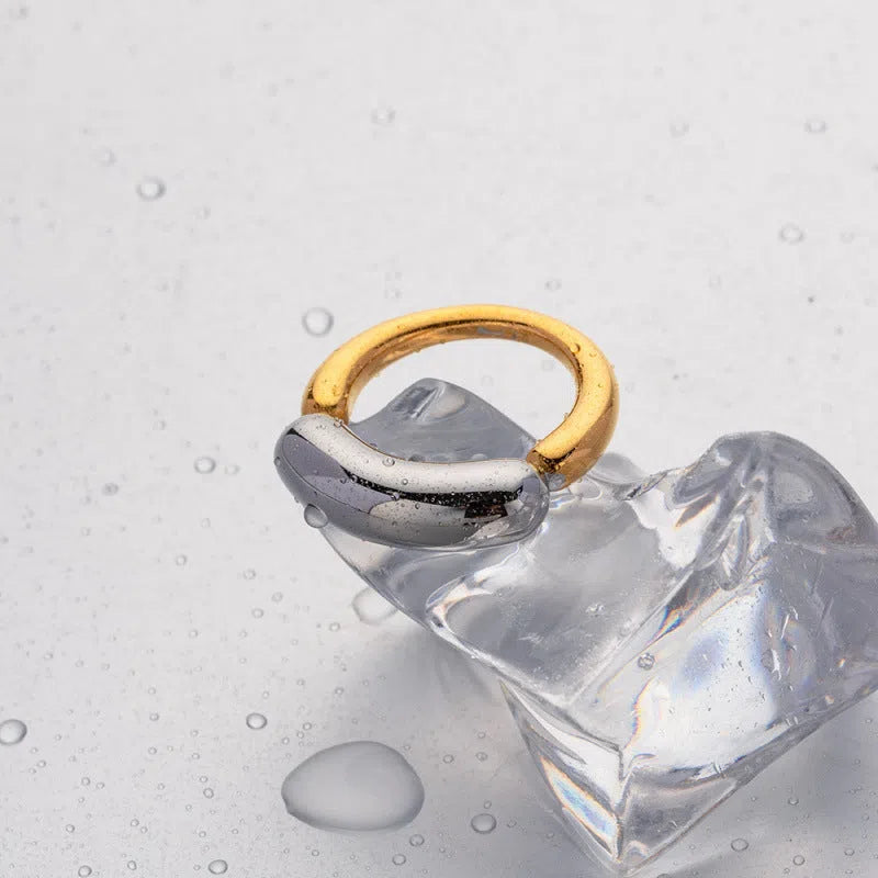 18K gold-plated double-arc geometric stainless steel ring for women on white background