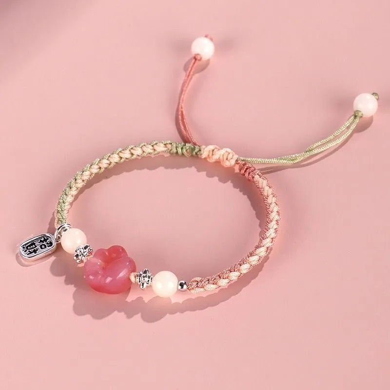 Handmade red cat's paw charm bracelet woven with pink or yellow glass beads in a pastoral couple's style.