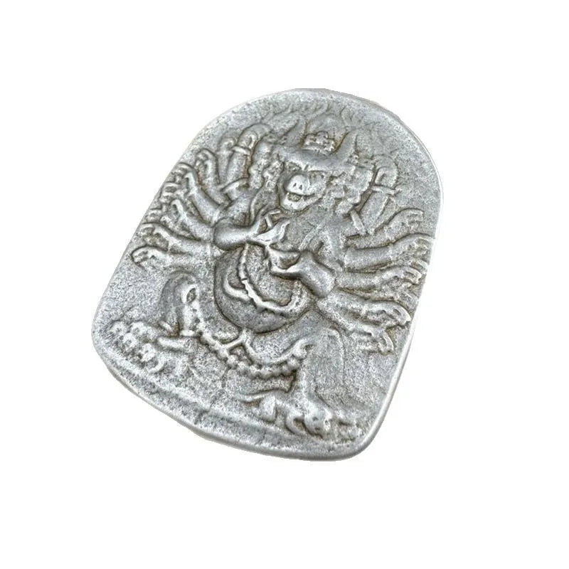 Close-up of a Chinese geometric style cast iron pendant ornament with an antique finish.