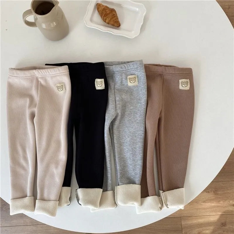 Girls' high-waist fleece-lined leggings in beige, black, brown, and grey colours on a size chart.