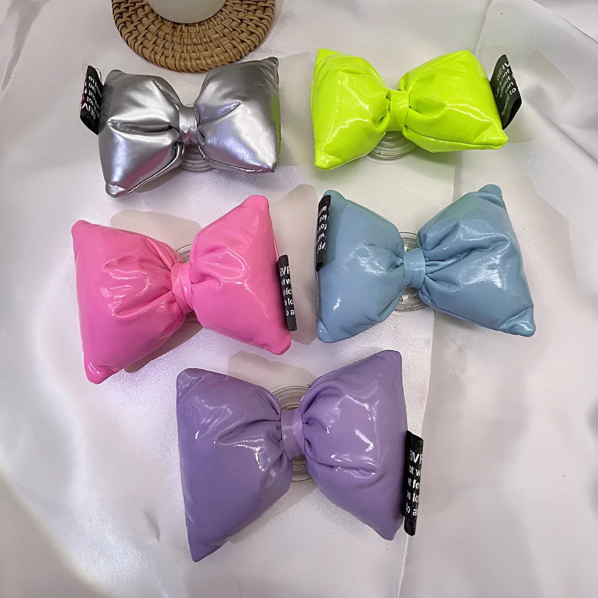 Girl's leather bow lazy bracket with transparent support in black, shown on a plain background
