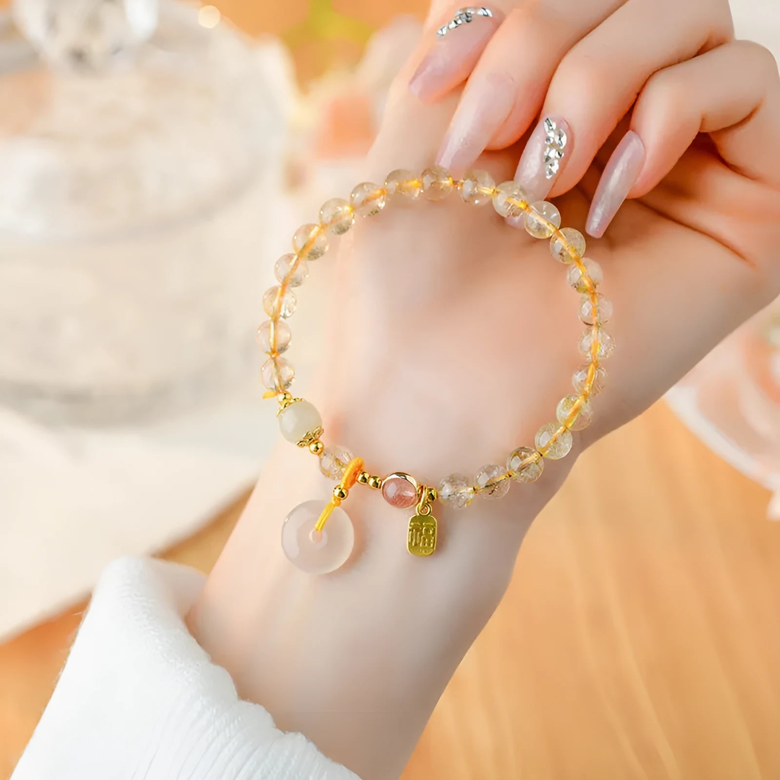 Gold rutilated quartz geometric crystal bracelet with peace buckle safety clasp and pendant charm