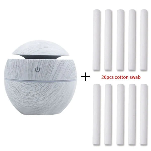 Mini USB aroma diffuser humidifier with wood grain finish, one fog outlet, and mechanical controls on a white background