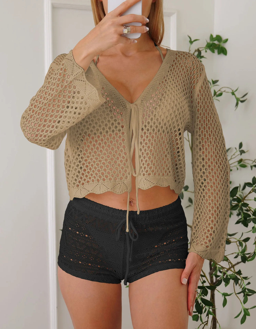 Short apricot women's cardigan blouse with bell sleeves and hollow woven texture.