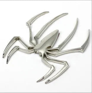 3D metal spider bumper sticker in gold on a car bumper