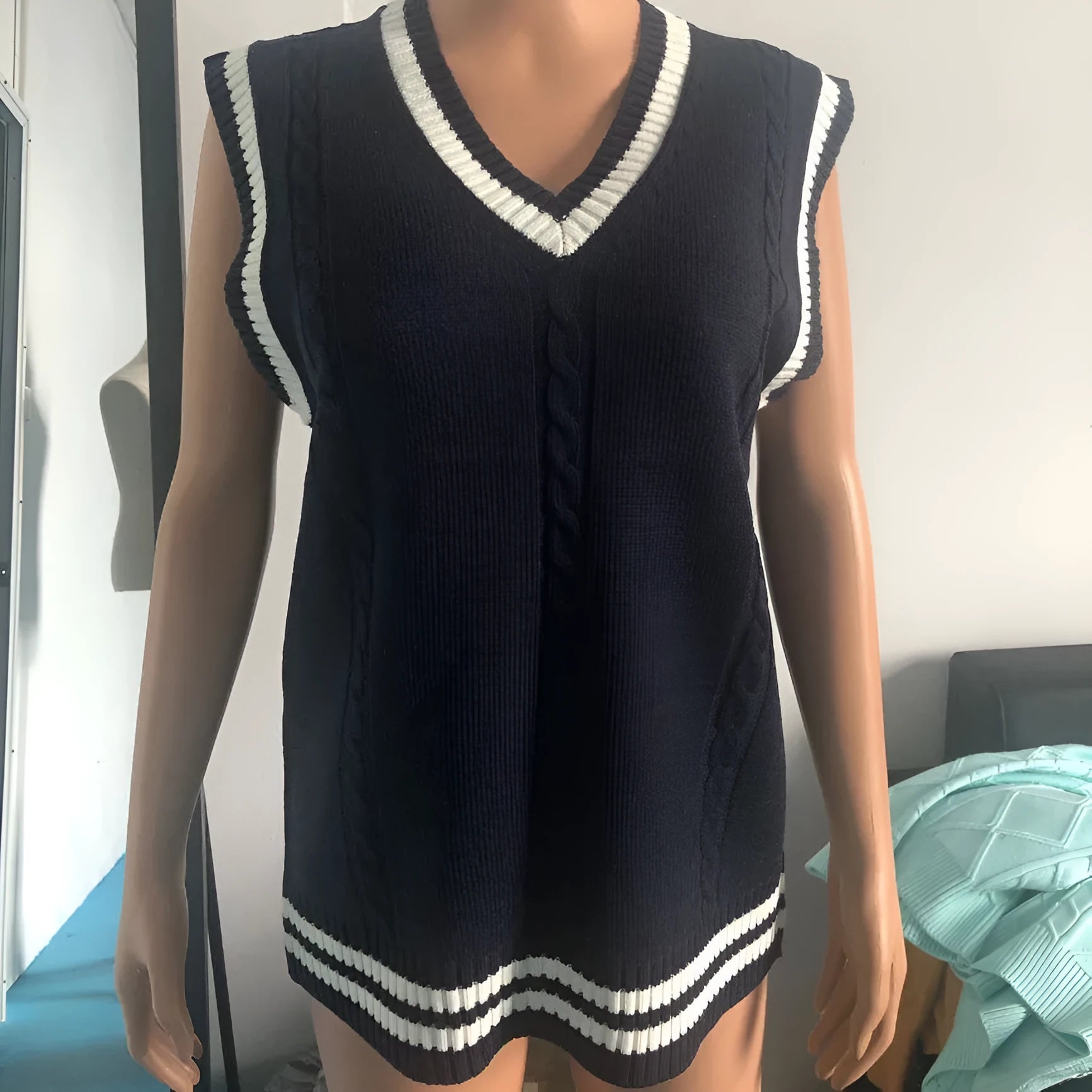 Women's slim fit V-neck acrylic waistcoat sweater with striped stitching in multiple colours.