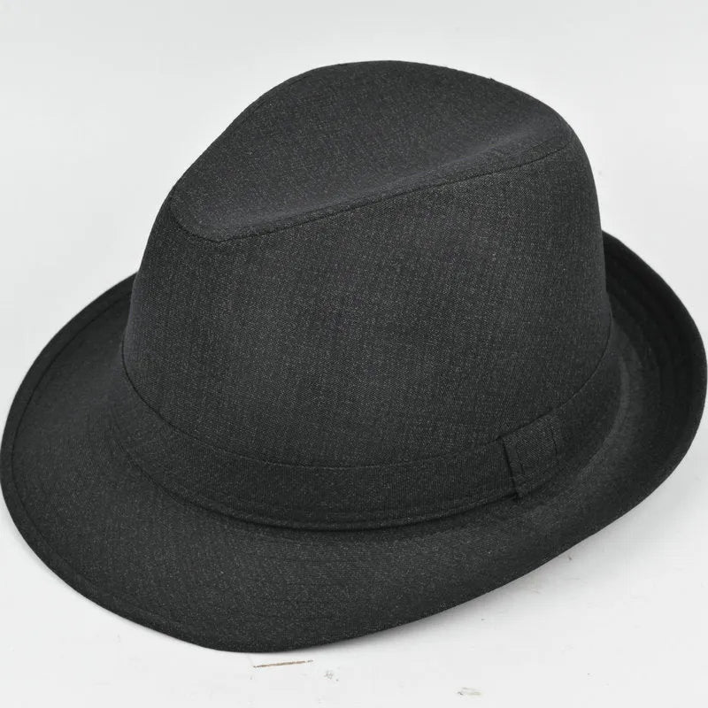 A classic brown fedora hat for men on a wooden stand, showing its structured crown and medium-width brim.