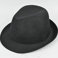 A classic brown fedora hat for men on a wooden stand, showing its structured crown and medium-width brim.