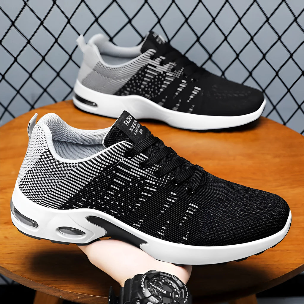 Men's low-top Flyknit mesh sneakers in black and grey colourway with lace-up front